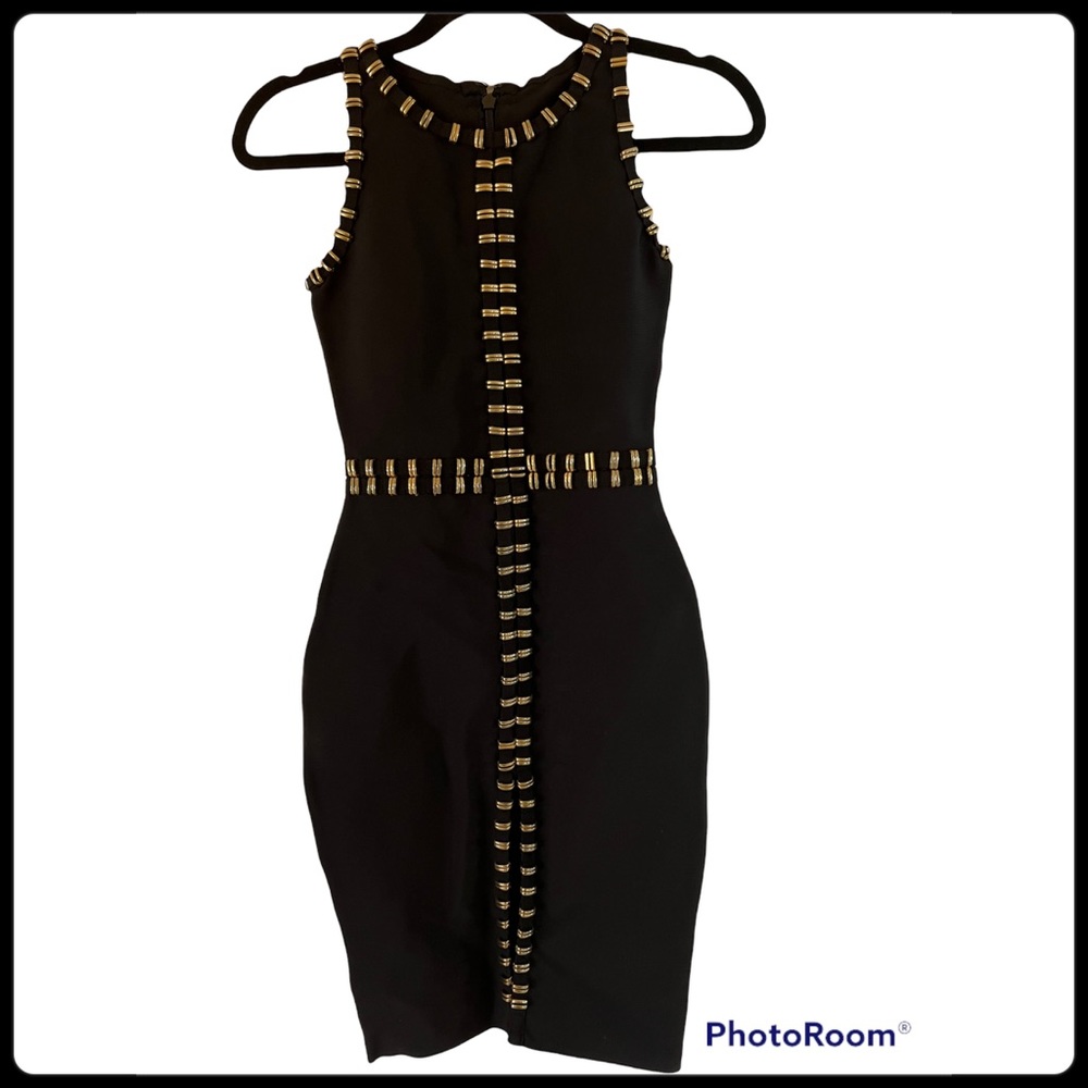 NWOT.  Sophisticated black dress with gold hardware